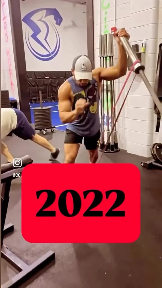 Reel cover: Collis mid-press on the landmine in the gym, a 2022 title card over it.